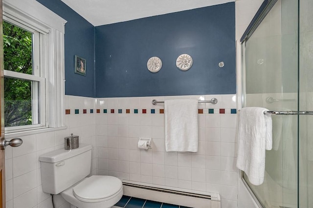 35 Warren Ave, Reading, MA 01867 - bathroom with baseboard heating, an enclosed shower, toilet, tile walls, and wainscoting