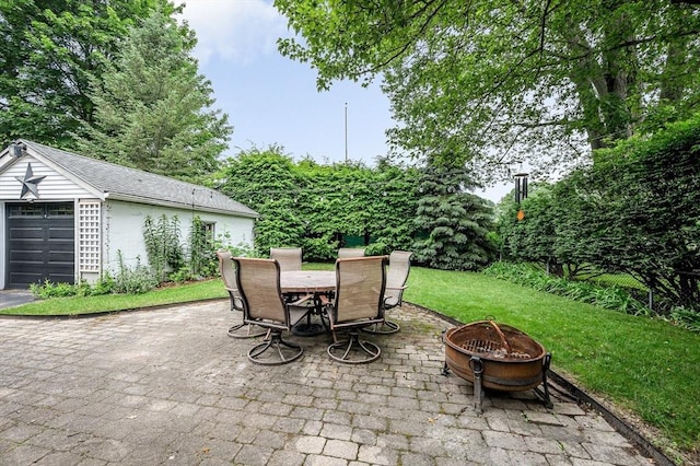 35 Warren Ave, Reading, MA 01867 - view of patio / terrace featuring a fire pit, outdoor dining space, and an outbuilding