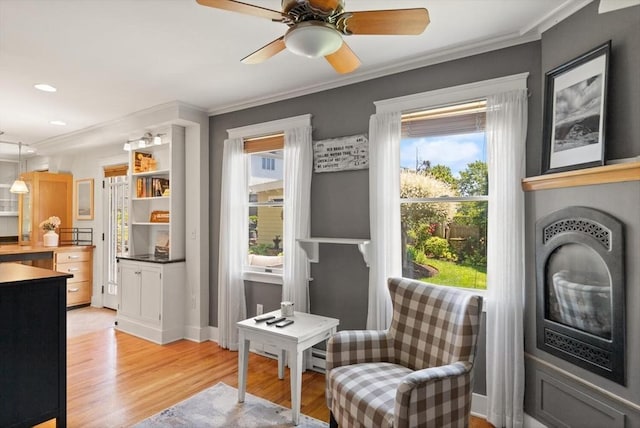 150 Prospect St Unit 3, Gloucester, MA 01930 - living area featuring light wood-style flooring, healthy amount of natural light, crown molding, ceiling fan, and recessed lighting