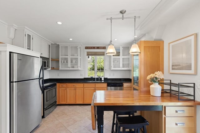 150 Prospect St Unit 3, Gloucester, MA 01930 - kitchen featuring appliances with stainless steel finishes, glass insert cabinets, open shelves, hanging light fixtures, and recessed lighting