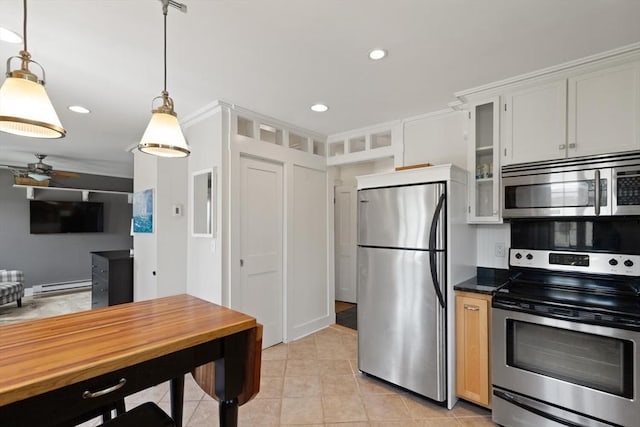150 Prospect St Unit 3, Gloucester, MA 01930 - kitchen featuring stainless steel appliances, glass insert cabinets, baseboard heating, light tile patterned floors, and decorative light fixtures