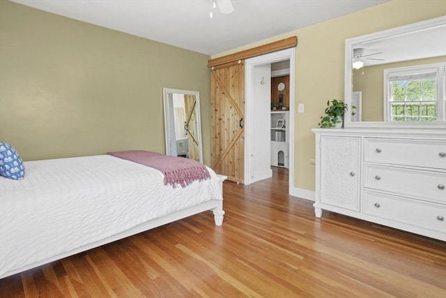 bedroom with ceiling fan and wood finished floors