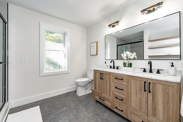 full bathroom with a sink, baseboards, a stall shower, and double vanity