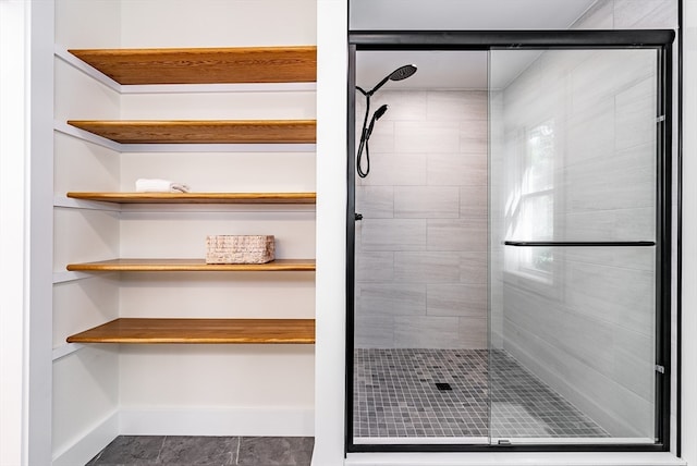 bathroom featuring tile patterned flooring and a shower with door