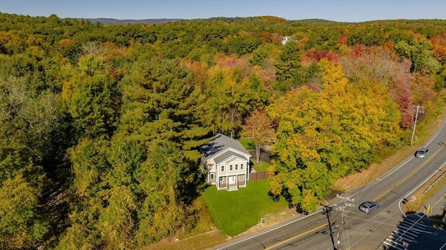 drone / aerial view featuring a view of trees
