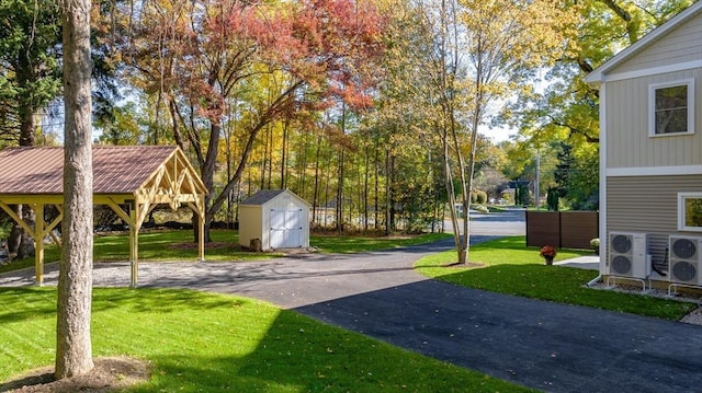 view of yard with a storage unit and an outbuilding