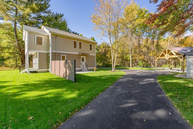 view of property exterior with a lawn