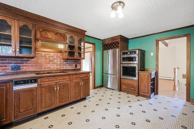 kitchen featuring a baseboard heating unit, crown molding, a textured ceiling, appliances with stainless steel finishes, and custom exhaust hood