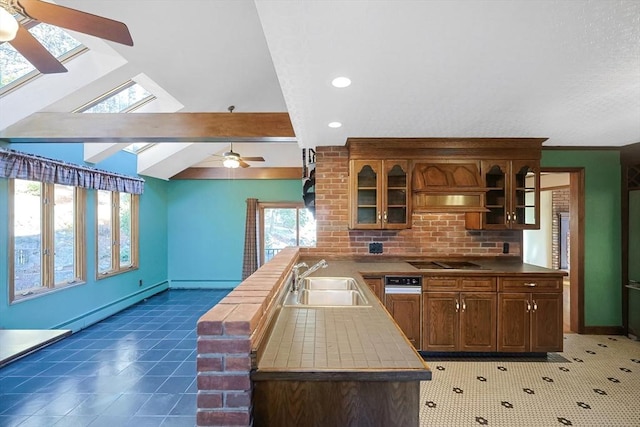 kitchen featuring sink, cooktop, a baseboard heating unit, kitchen peninsula, and lofted ceiling with skylight