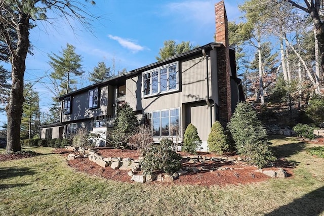 rear view of house with a yard