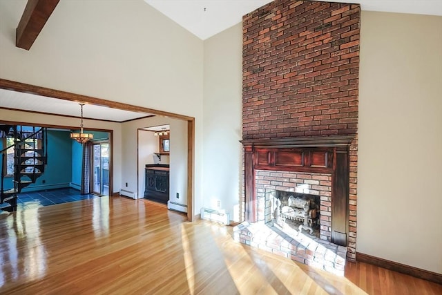 unfurnished living room with baseboard heating, vaulted ceiling with beams, a fireplace, and hardwood / wood-style floors