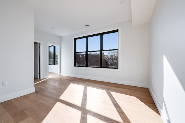 spare room with light hardwood / wood-style floors