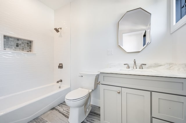 full bathroom featuring tiled shower / bath combo, tile flooring, toilet, and large vanity