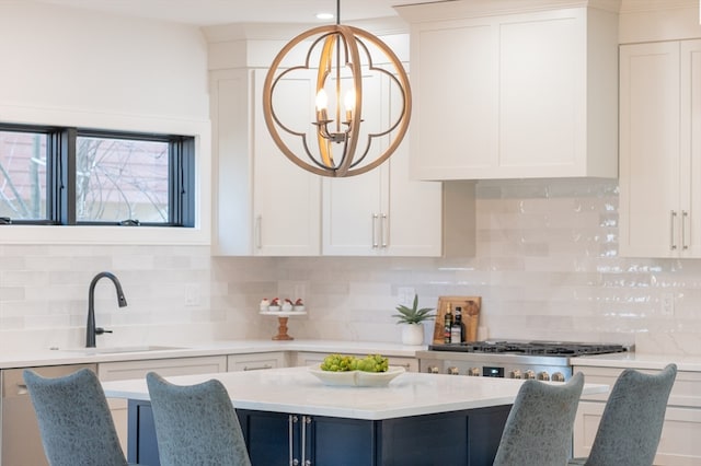 kitchen with a notable chandelier, hanging light fixtures, backsplash, and sink