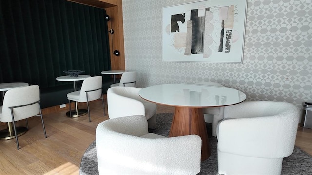 191 Washington St Unit 309, Boston, MA 02135 - dining space featuring wood finished floors and wallpapered walls