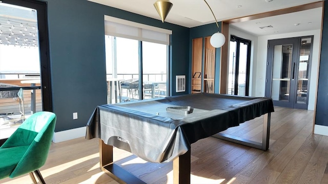 191 Washington St Unit 309, Boston, MA 02135 - playroom featuring french doors, wood finished floors, pool table, and healthy amount of natural light