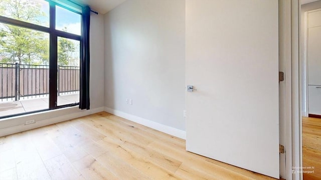 191 Washington St Unit 309, Boston, MA 02135 - spare room with light wood-style floors and baseboards