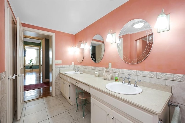 bathroom featuring tile walls, tile patterned floors, and vanity