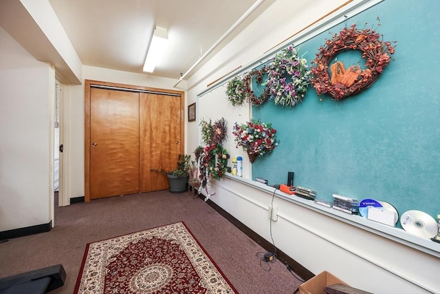 foyer with carpet flooring