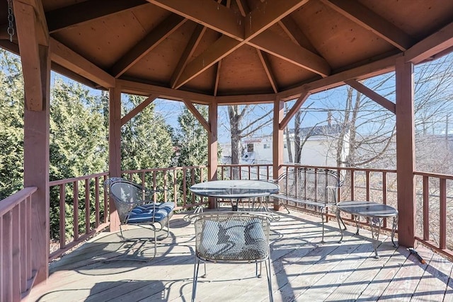 wooden terrace featuring a gazebo