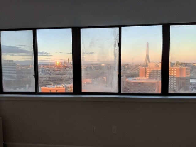 unfurnished room with a city view