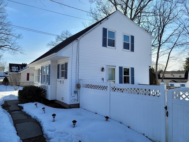 view of front of home with a gate and fence