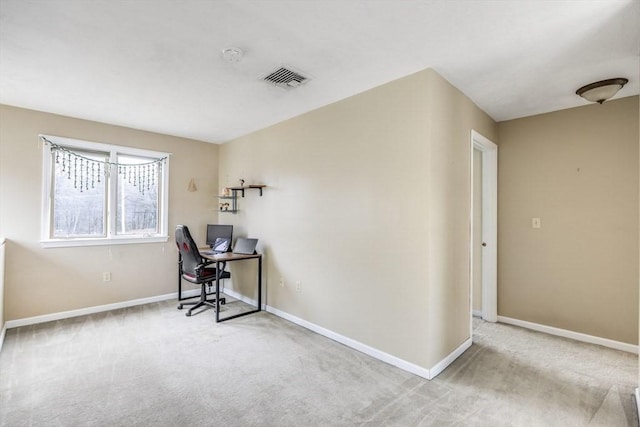 unfurnished office featuring baseboards and carpet