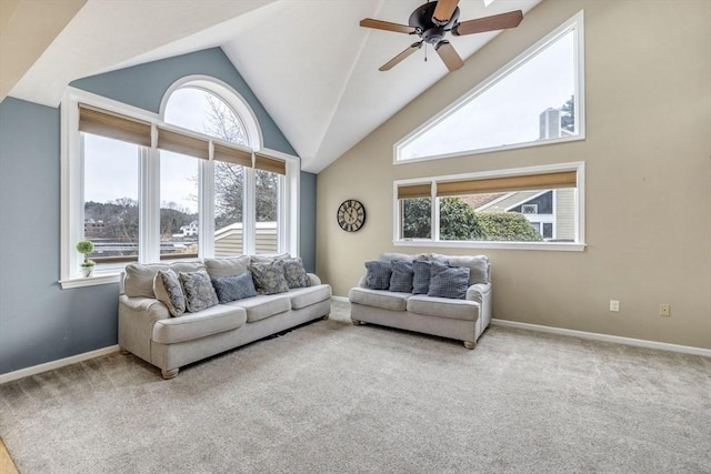 living room featuring a ceiling fan, baseboards, carpet floors, and high vaulted ceiling