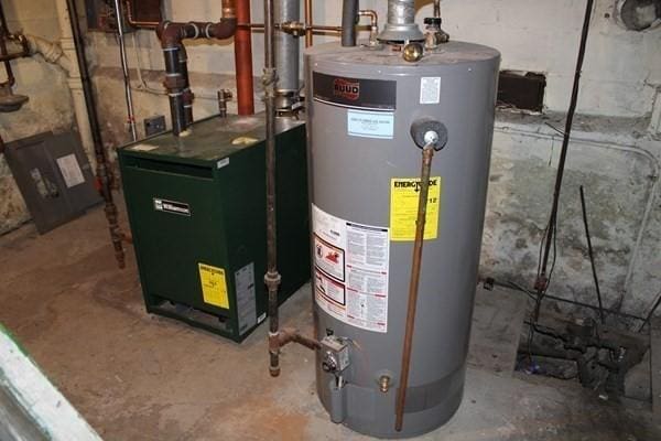 220 W W, Boston, MA 02136 - utility room featuring water heater and a heating unit