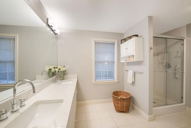 full bath with baseboards, a sink, and a shower stall