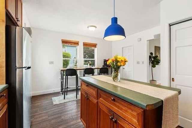 6 Francis Ave, Wakefield, MA 01880 - kitchen with freestanding refrigerator, dark wood-style flooring, baseboards, and brown cabinetry