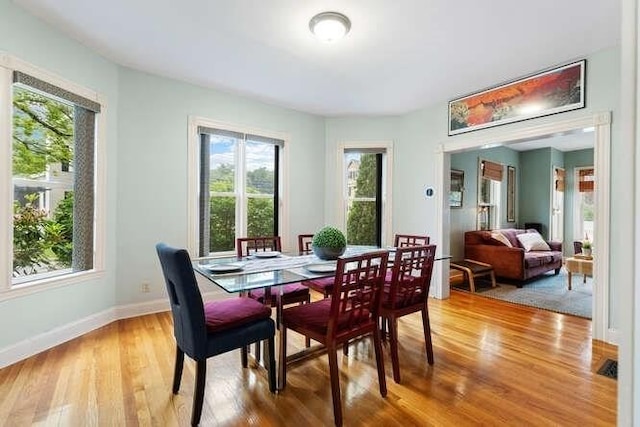 6 Francis Ave, Wakefield, MA 01880 - dining room with light wood-style floors, healthy amount of natural light, and baseboards