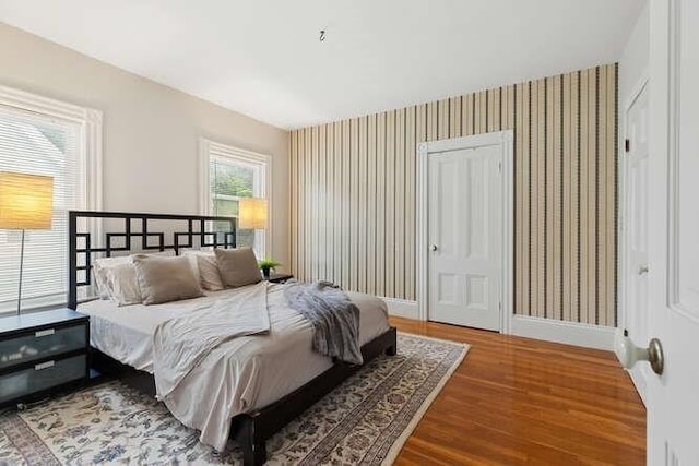 6 Francis Ave, Wakefield, MA 01880 - bedroom with wood finished floors, wallpapered walls, and baseboards
