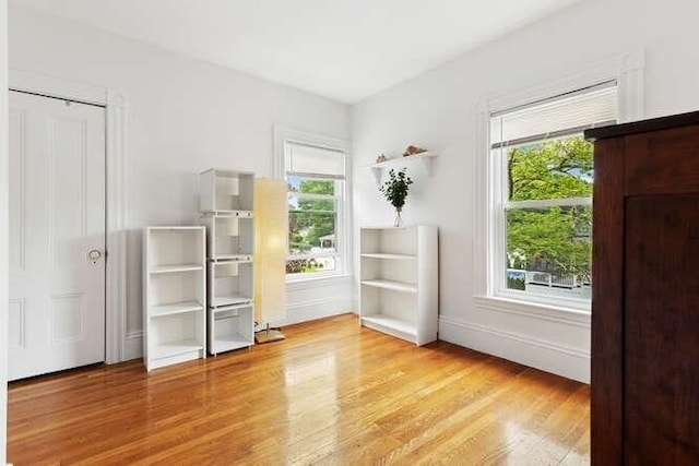 6 Francis Ave, Wakefield, MA 01880 - unfurnished bedroom with wood finished floors, baseboards, and refrigerator