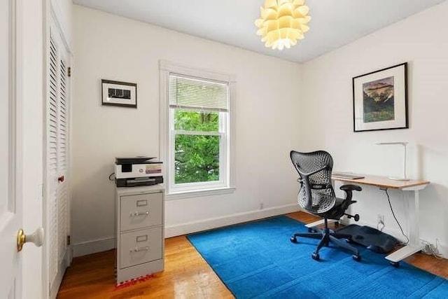 6 Francis Ave, Wakefield, MA 01880 - home office with wood finished floors, baseboards, and a chandelier