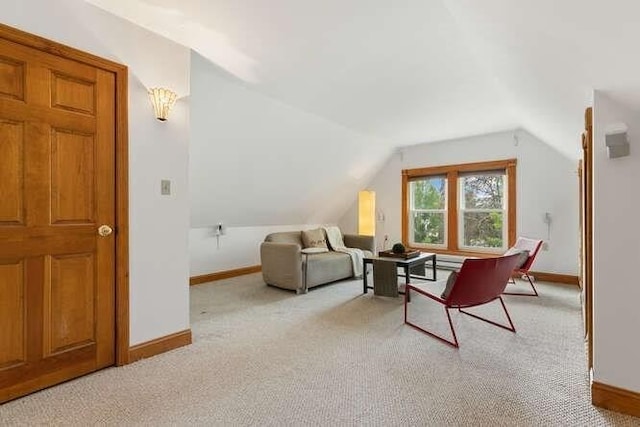 6 Francis Ave, Wakefield, MA 01880 - living area featuring light colored carpet, baseboards, and vaulted ceiling