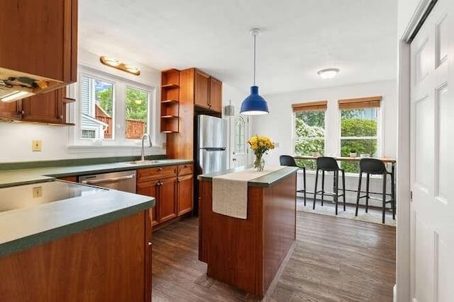 6 Francis Ave, Wakefield, MA 01880 - kitchen with stainless steel dishwasher, healthy amount of natural light, and brown cabinetry
