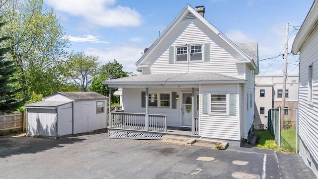 11 Shale St, Worcester, MA 01604 - back of property with covered porch, a shingled roof, and a chimney