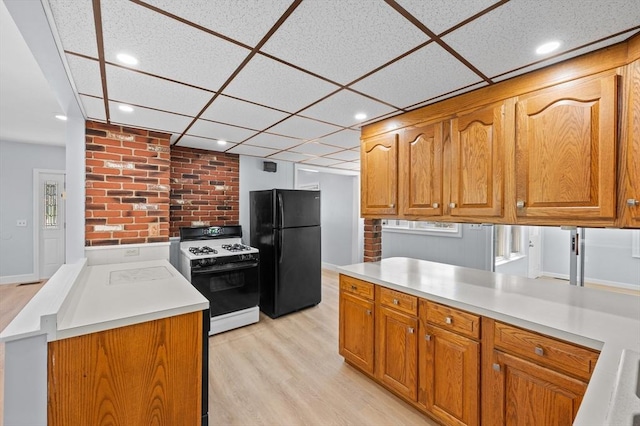 11 Shale St, Worcester, MA 01604 - kitchen featuring gas range, freestanding refrigerator, recessed lighting, light wood-style flooring, and light countertops