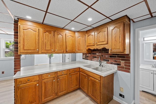 11 Shale St, Worcester, MA 01604 - kitchen featuring a sink, light wood-type flooring, brown cabinetry, light countertops, and recessed lighting