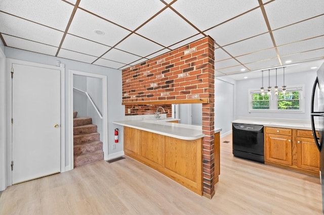 11 Shale St, Worcester, MA 01604 - kitchen with black dishwasher, light wood-style floors, a paneled ceiling, light countertops, and recessed lighting
