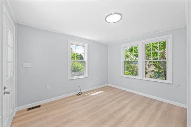11 Shale St, Worcester, MA 01604 - unfurnished room with light wood finished floors, baseboards, and crown molding