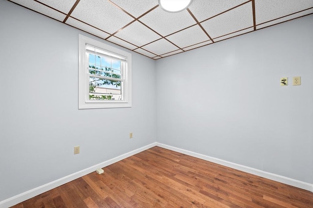 11 Shale St, Worcester, MA 01604 - empty room with wood finished floors, baseboards, and a drop ceiling