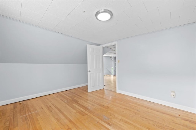 11 Shale St, Worcester, MA 01604 - additional living space with wood finished floors, vaulted ceiling, and baseboards
