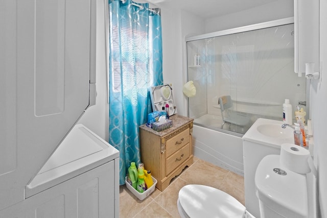 full bathroom featuring enclosed tub / shower combo, vanity, tile patterned flooring, and toilet