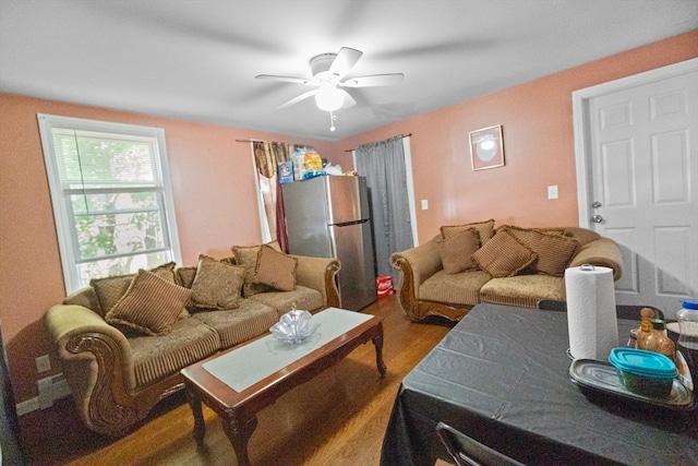 living room with ceiling fan and wood-type flooring