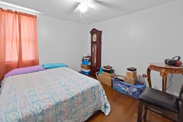 bedroom featuring dark wood-type flooring and ceiling fan