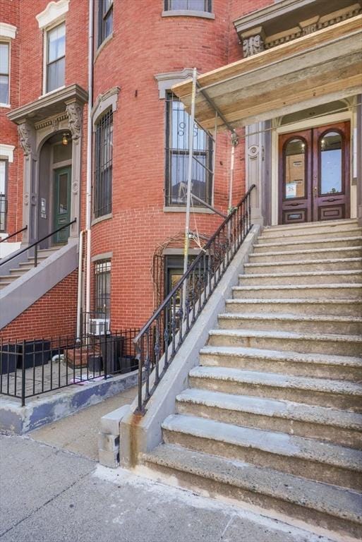 762 Tremont St Unit 5, Boston, MA 02118 - property entrance with brick siding and french doors