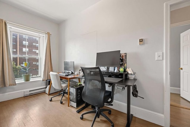 762 Tremont St Unit 5, Boston, MA 02118 - office featuring wood finished floors, a baseboard radiator, and baseboards