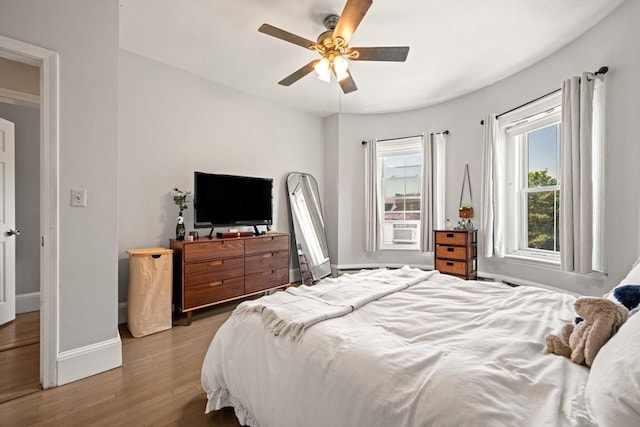 762 Tremont St Unit 5, Boston, MA 02118 - bedroom featuring baseboards, wood finished floors, ceiling fan, and cooling unit